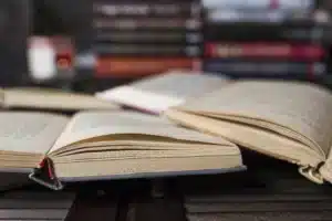 Law books representing the Corporate Sustainability Reporting Directive (CSRD)